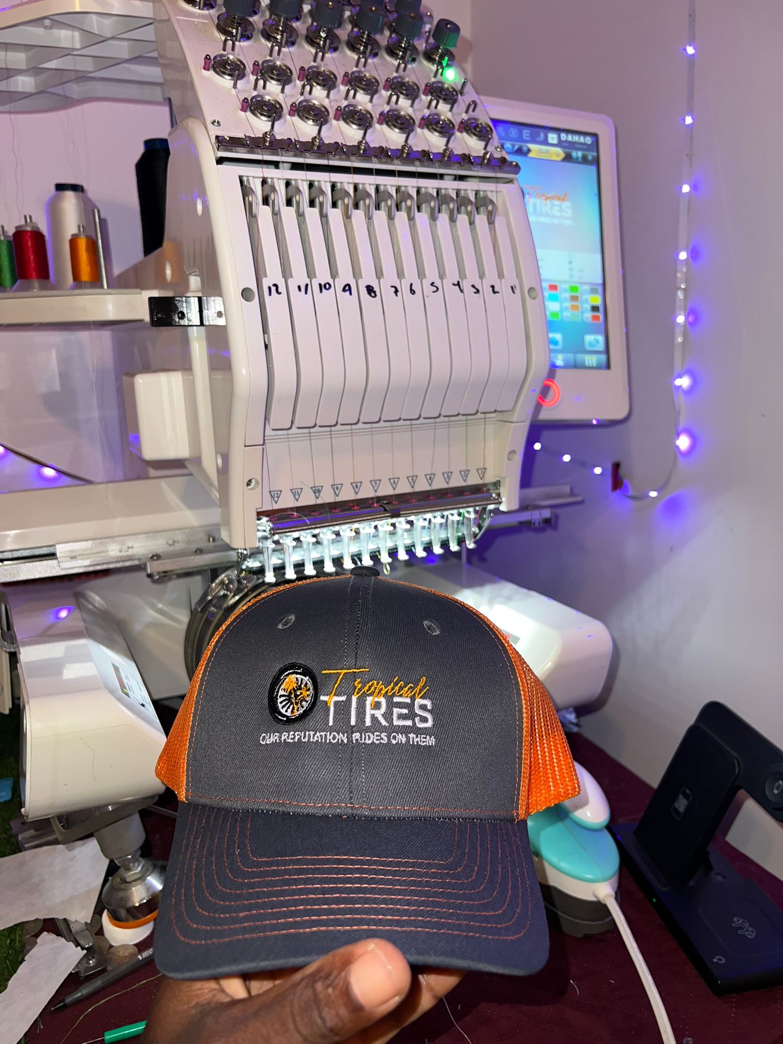 Commercial embroidery machine producing branded apparel at KiX Creative Studios