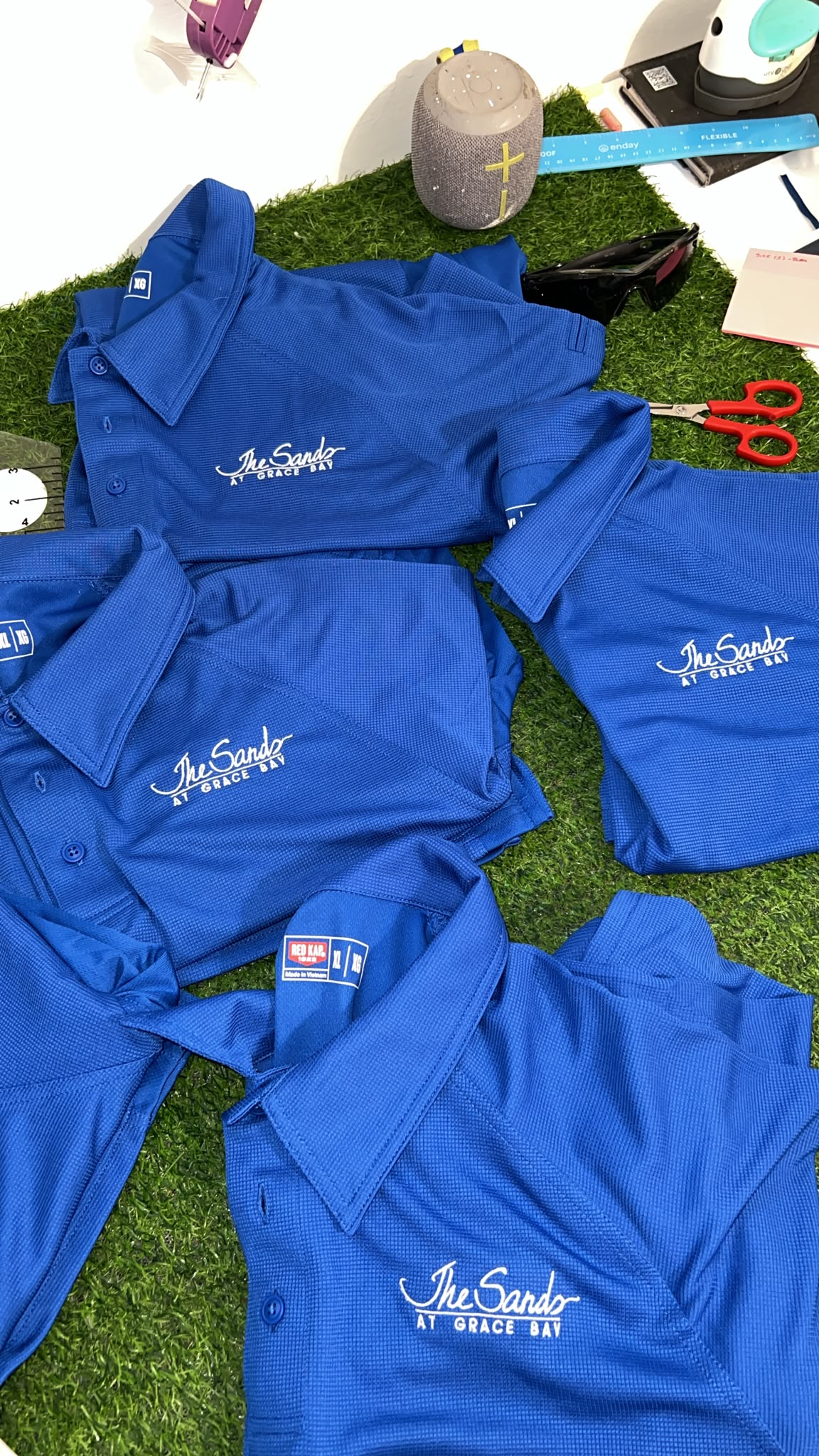 Finished branded staff uniform program produced by KiX Creative Studios